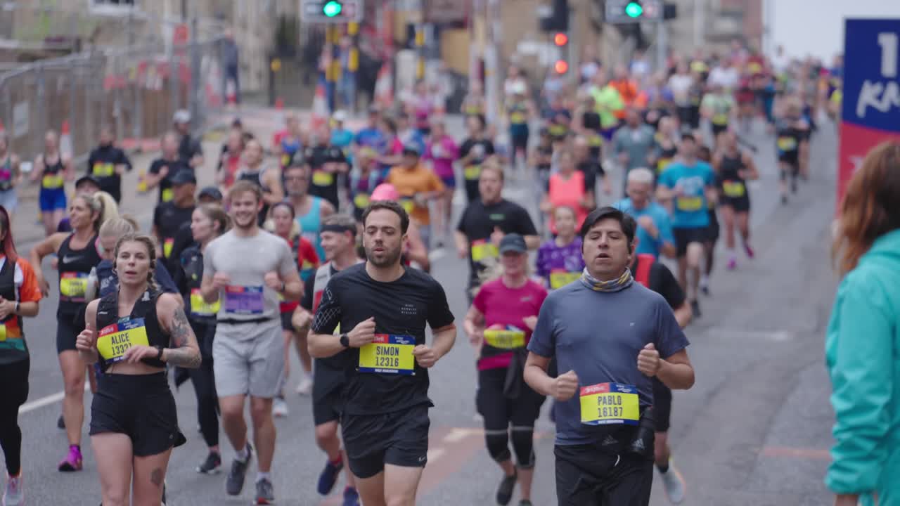 Large Group of People Running in a Marathon