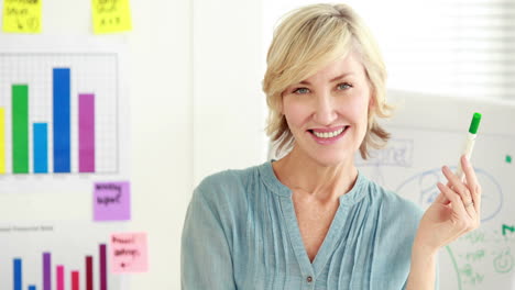 businesswoman-with-graphics-and-marker