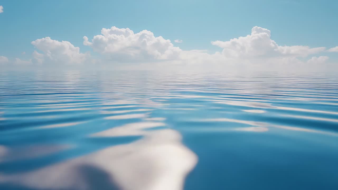 Bobbing camera sending ocean surface rippling with gleam and blurred patch, horizon cloud bank