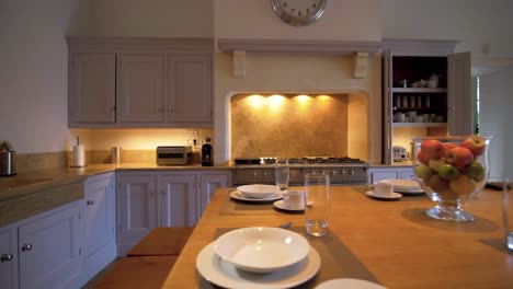 slider shot of luxurious grand kitchen inside villa with ambient lighting