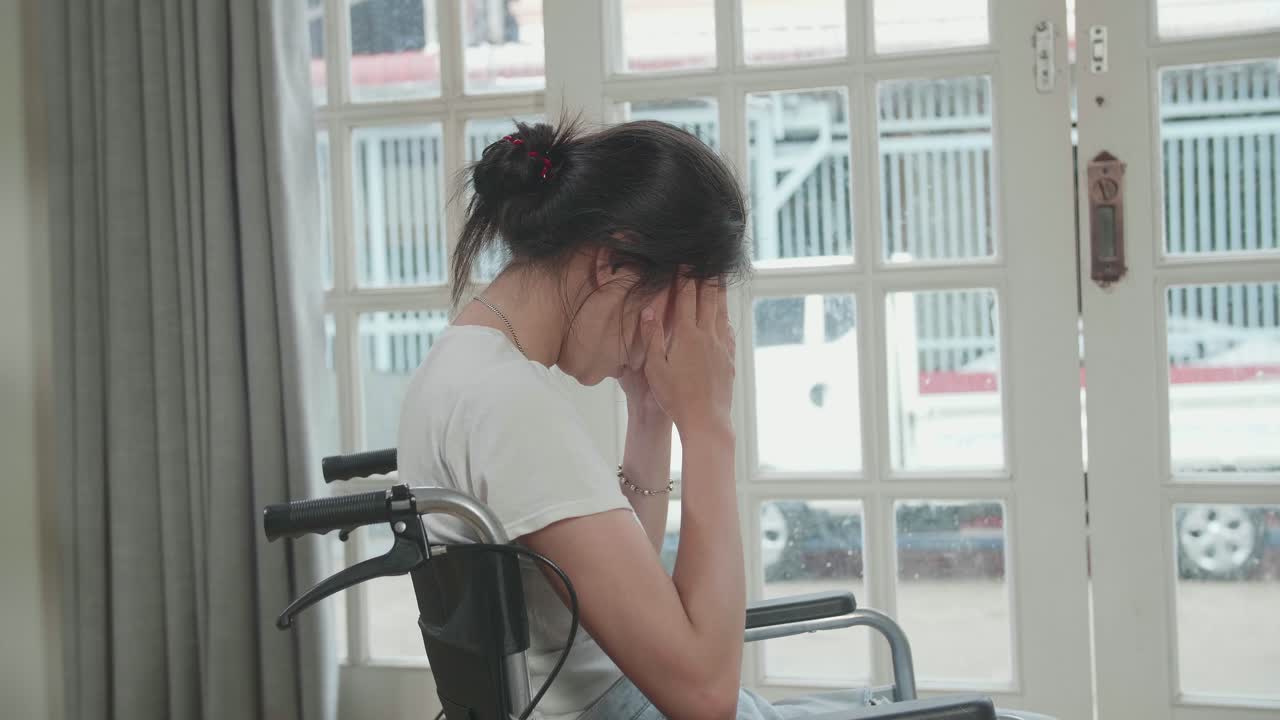 Woman in Wheelchair Suffering