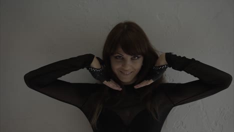 Woman in Black Clothing and Gloves