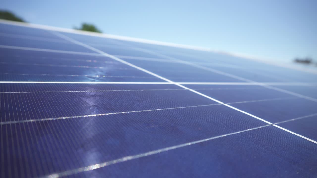 Solar panel in bright sunlight, sustainable energy supply on solar farm, closeup shallow focus