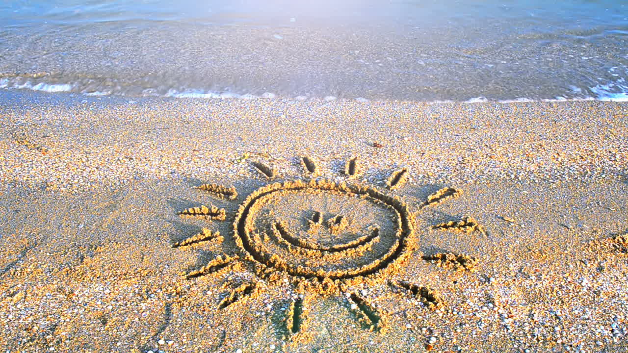 Sun drawing on the beach. Beach and drawing
