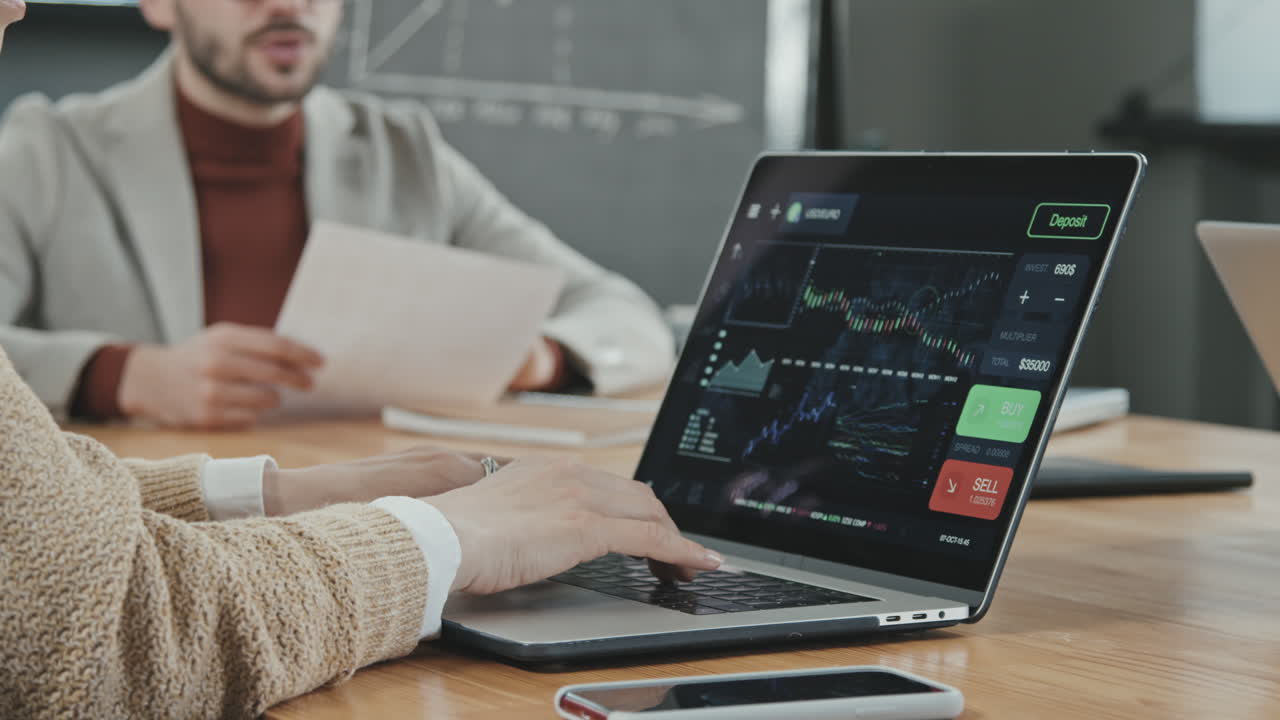 Unrecognizable Female Investor Working on Laptop