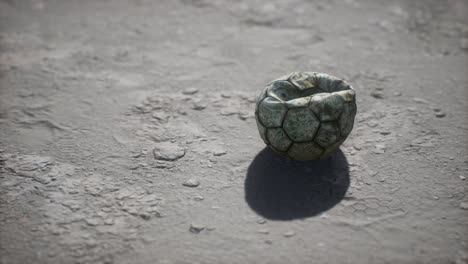 old soccer ball the cement floor