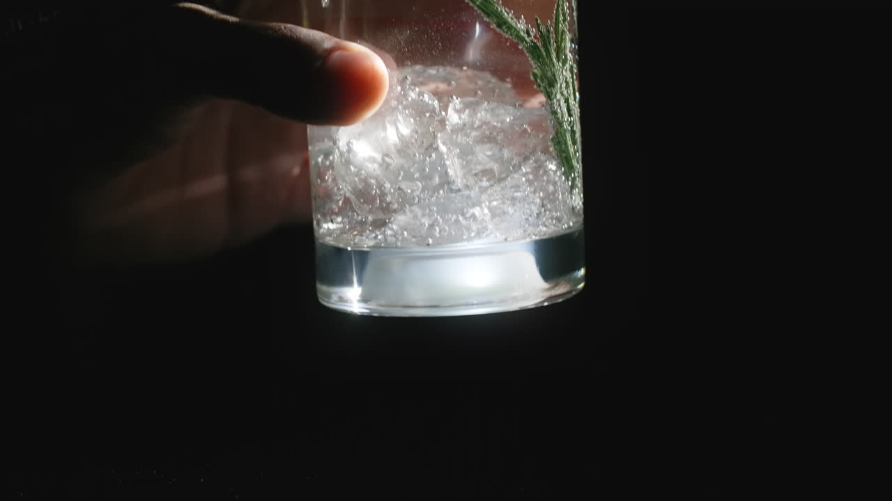 Refreshing Iced Cocktail with Rosemary