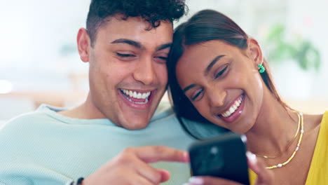 Relax,-laugh-and-happy-couple-with-phone-in-home