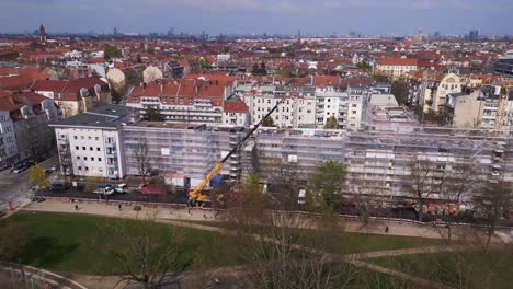 Vehicle-crane-Best-aerial-top-view-flight-Berlin-City-Construction-work-on-house-with-crane