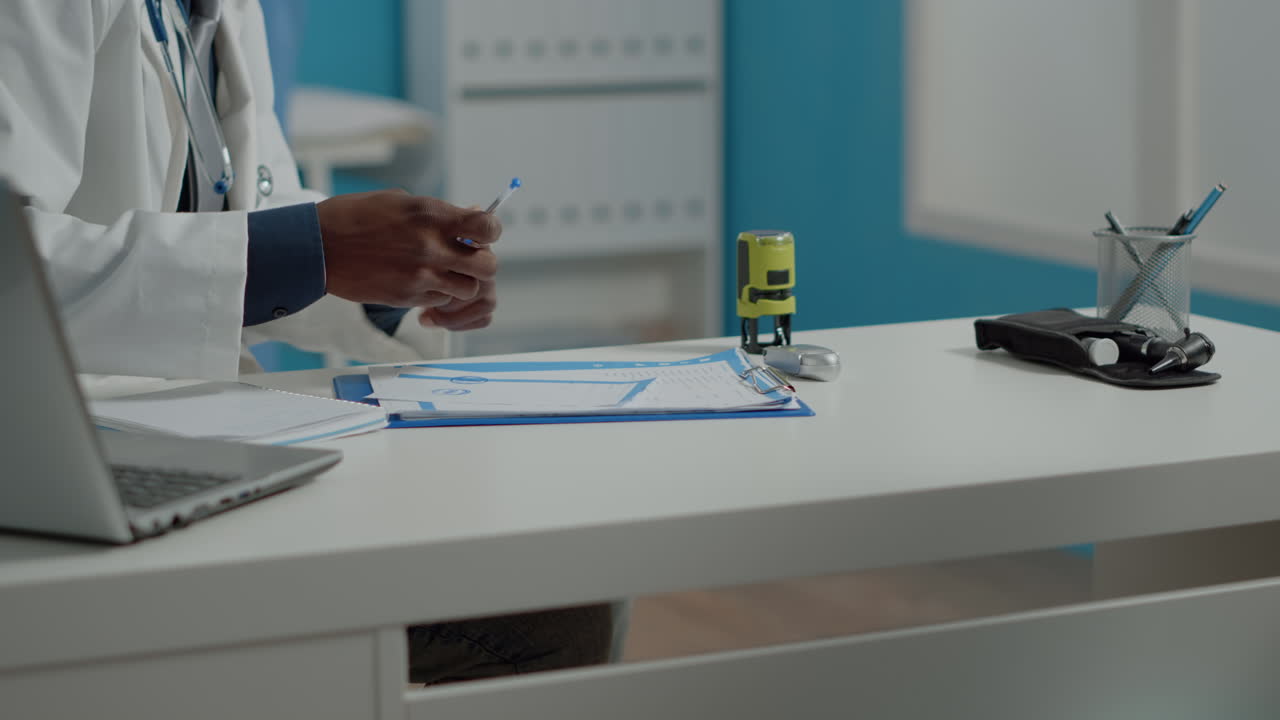 Close up of healthcare specialist using tools and files