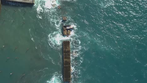 aerial view of the waves destruction on the deactivated marina of lugar de baixo, ponta do sol, madeira ísland, portugal