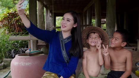 Woman and Children Taking a Selfie in a Rural Setting