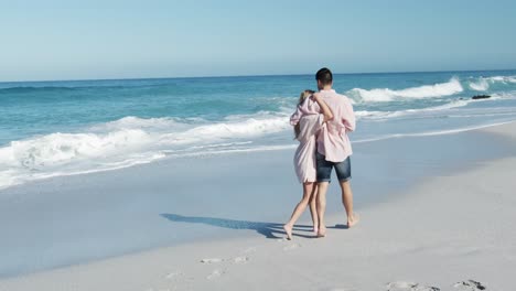 couple in love enjoying free time on the beach together