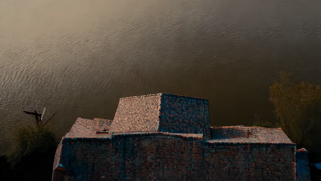 aerial view of house on the riverbank