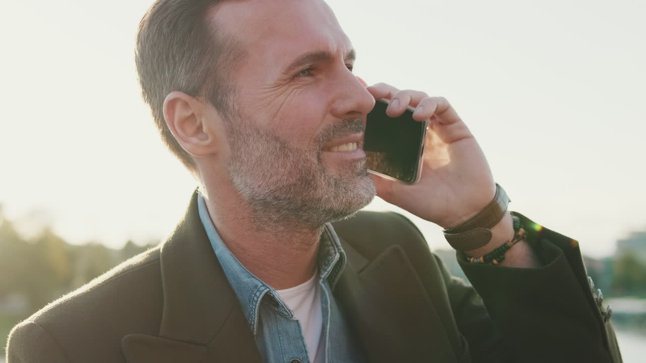 Man talking on a phone outdoors