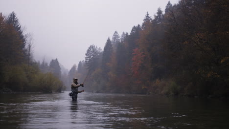 autumn fly fishing on a misty river