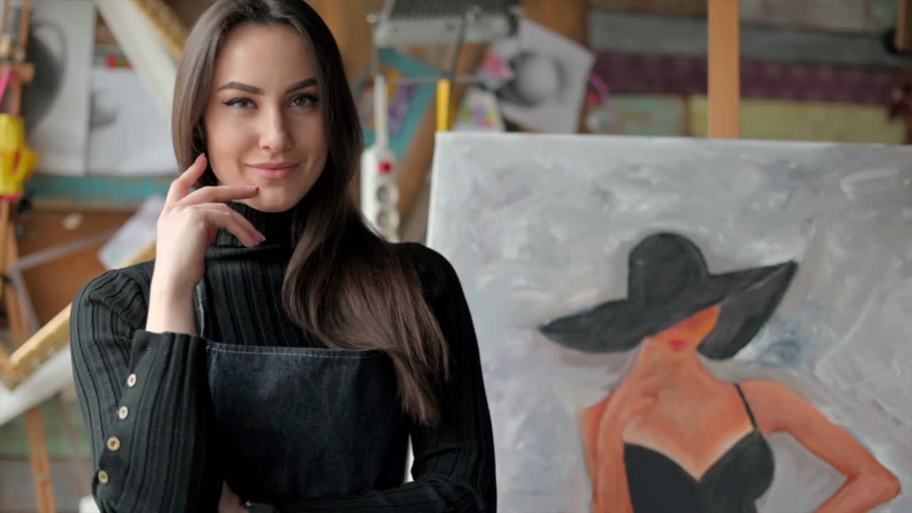 Woman standing in front of a painting at an art gallery workshop