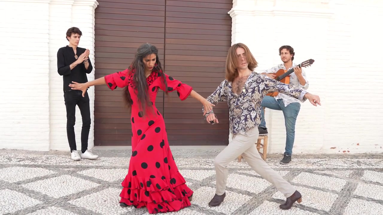 Multiethnic group of flamenco dancers dancing for tourists in san nicolas albaicin