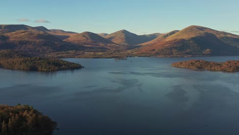 high above lake lomond and the trossachs national park with scenic mountainous views in warm sunglight in scotland