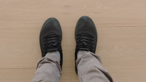 above view man wearing shoes enjoying stylish footware standing on wooden floor