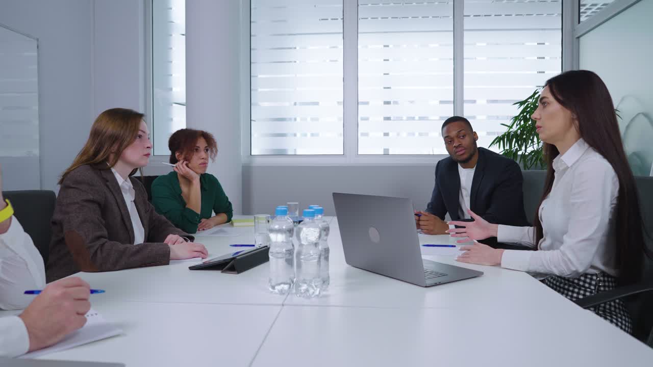 Company executives discussing strategy at business meeting