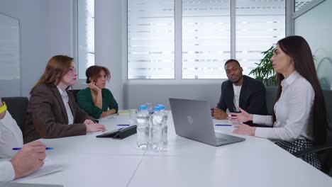 company executives discussing strategy at business meeting