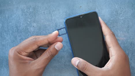 inserting a sim card into a mobile phone