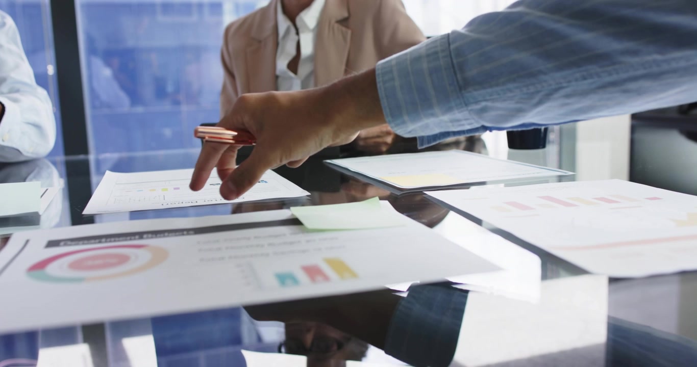 Right hand reaching and pointing at business reports with charts, panels sliding, LEVEL UP growing