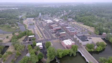 downtown three rivers, michigan with drone video moving in wide shot