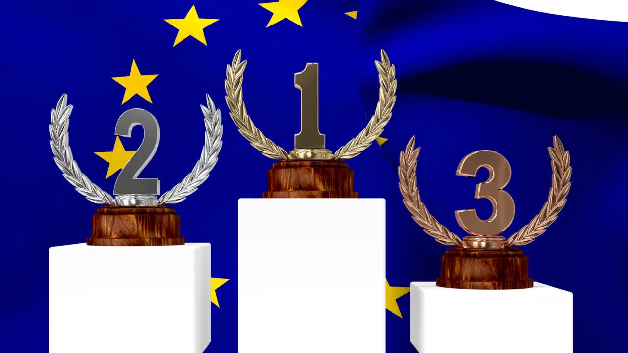 trofeos frente a la bandera europea ondeando