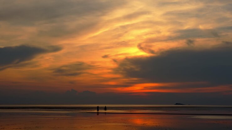Sunset at the Beach with Silhouettes