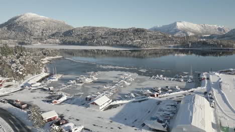 drone flies calmly down towards håhjem marine in ålesund