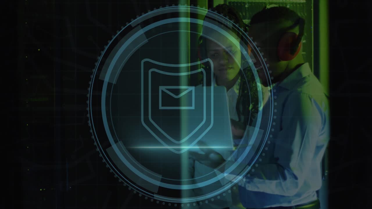 Animation of shield icon over african american male and female engineer using laptop at server room