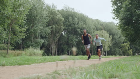 fit couple running and jogging in the park