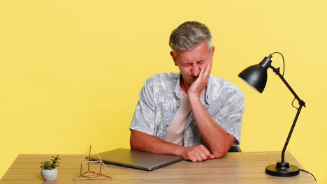 adult man bored looking at laptop sighs waves hand closes lid slowly showing tired disappointment