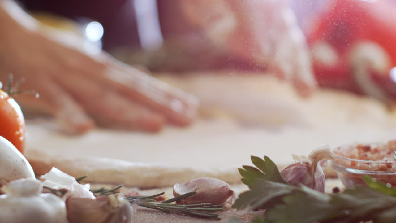 Preparing pizza dough with fresh ingredients