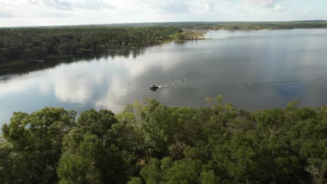 motorboat cruising on crystal lake in polk county, florida, usa