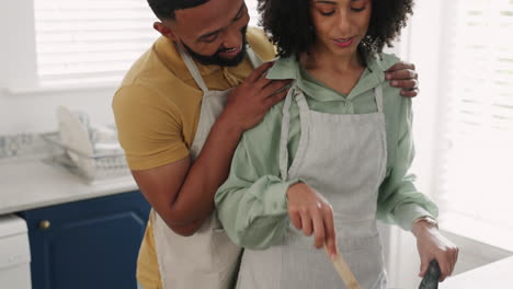 Couple,-cooking-food-and-relax-in-kitchen-together