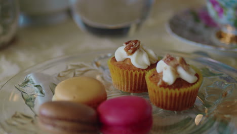 panning shot of macarons and delicious desserts at a tea party