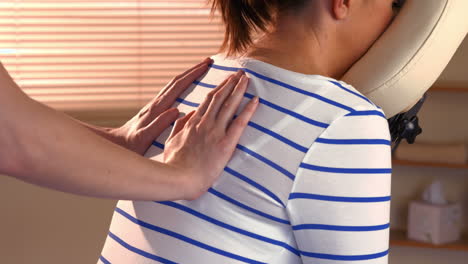 Woman-enjoying-a-chair-massage