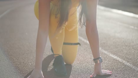 female runner in starting position