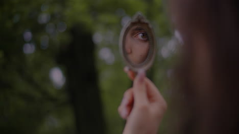 innocent woman looking into mirror