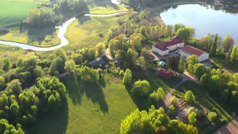 Historical-manor-and-magical-green-landscape-of-Latvia,-aerial-drone-view