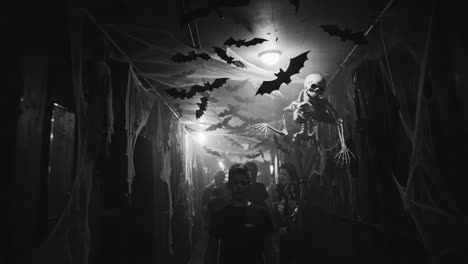 haunted hallway featuring eerie decorations and suspenseful atmosphere with bats and ghoulish figures, perfect for spooky season festivities and horror events