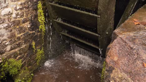 Close-up-on-a-section-of-a-wooden-water-wheel-from-a-water-mill