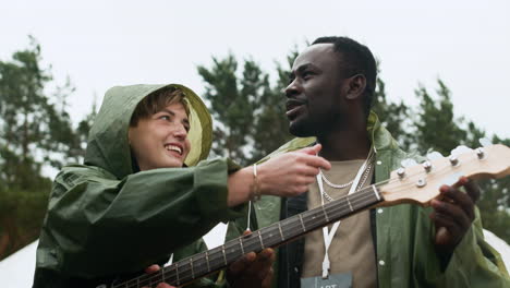 friends talking about music outdoors