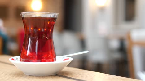 empty cup of turkish tea on a wooden table