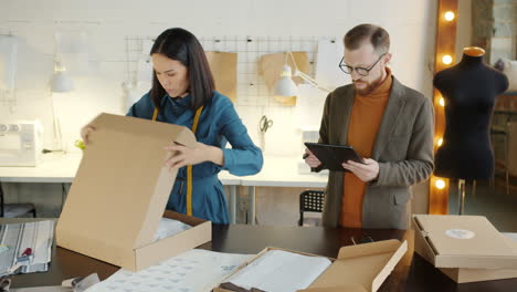 fashion design team packaging orders