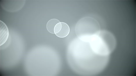 gray abstract background with bokeh. loop animations. with a central location for the text .