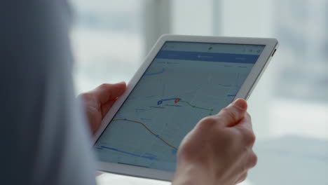 person using a tablet with a navigation app